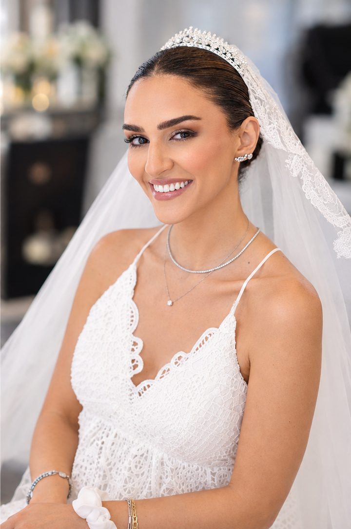 Bride in lace veil and tiara with soft bronze glam